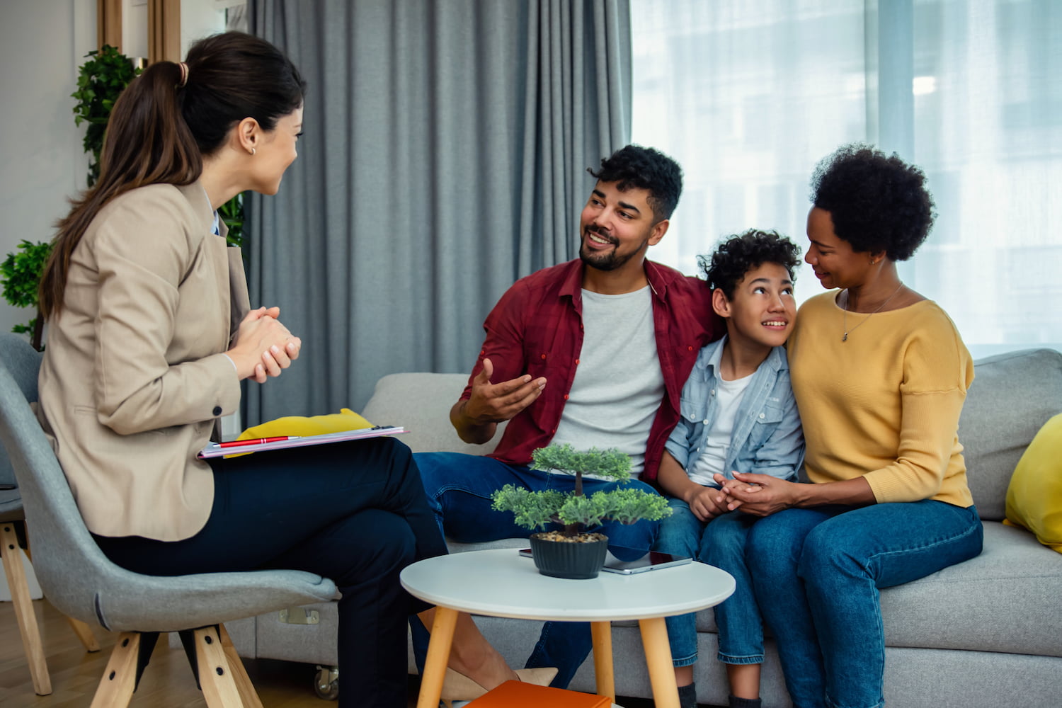Three members of a family talking to a therapist